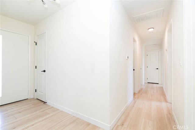 hall with light hardwood / wood-style floors