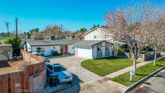 single story home with a garage and a front lawn