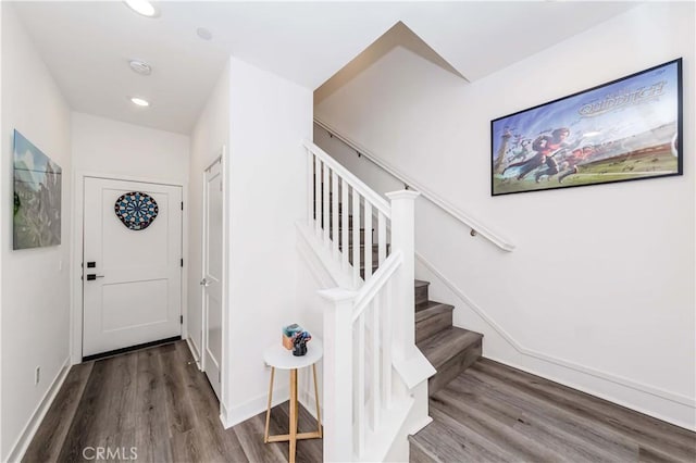 stairway with hardwood / wood-style flooring