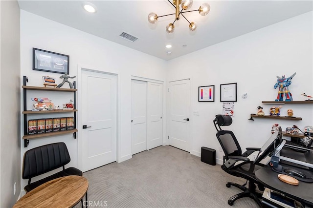 office area with an inviting chandelier and light colored carpet