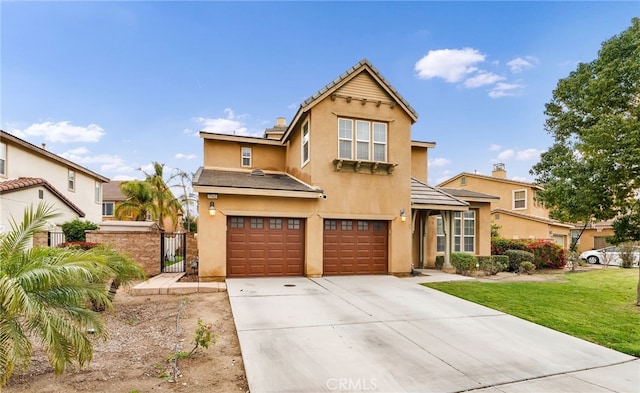 view of front of home with a garage and a front lawn