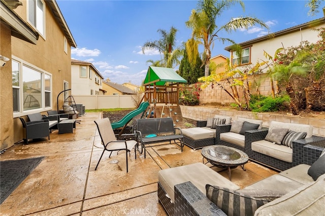 view of patio / terrace featuring a playground and outdoor lounge area