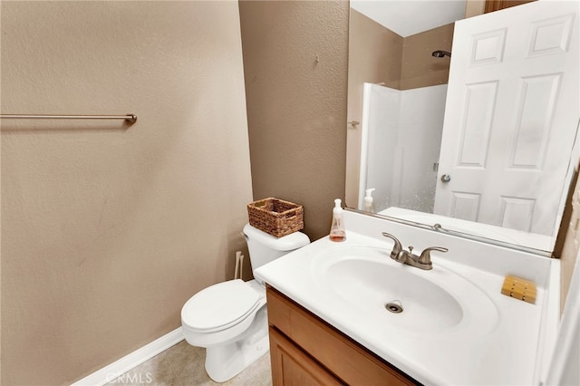 bathroom with walk in shower, tile patterned floors, vanity, and toilet