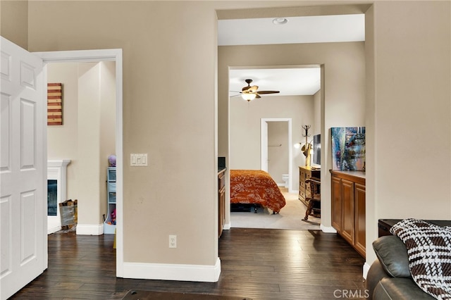 hall with dark wood-type flooring