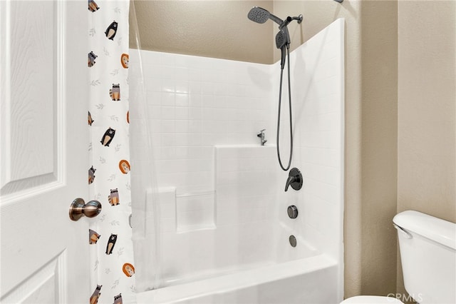 bathroom with shower / bath combination with curtain and toilet