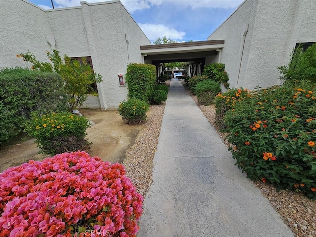 view of side of property featuring a carport