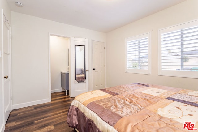 bedroom with dark hardwood / wood-style flooring