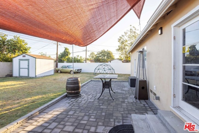 view of patio featuring a shed