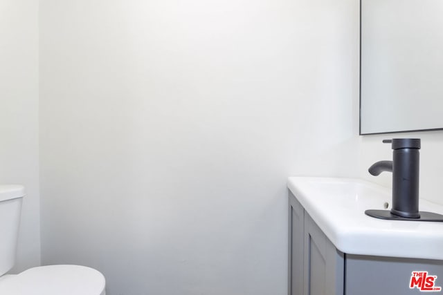 bathroom with vanity and toilet