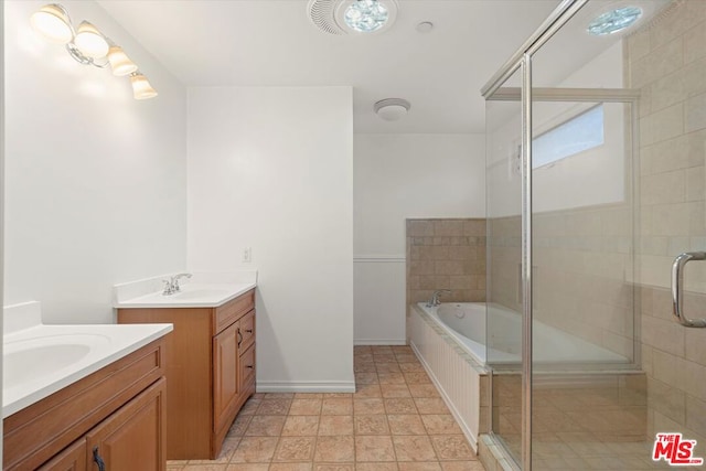 bathroom with independent shower and bath and vanity