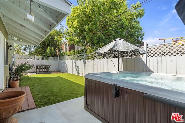 view of patio with a hot tub