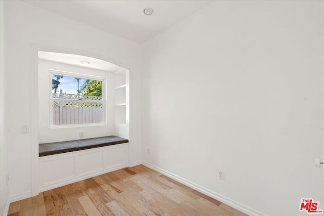 unfurnished room featuring light wood-type flooring