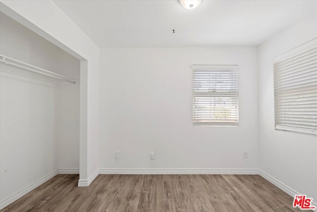 unfurnished bedroom featuring hardwood / wood-style floors