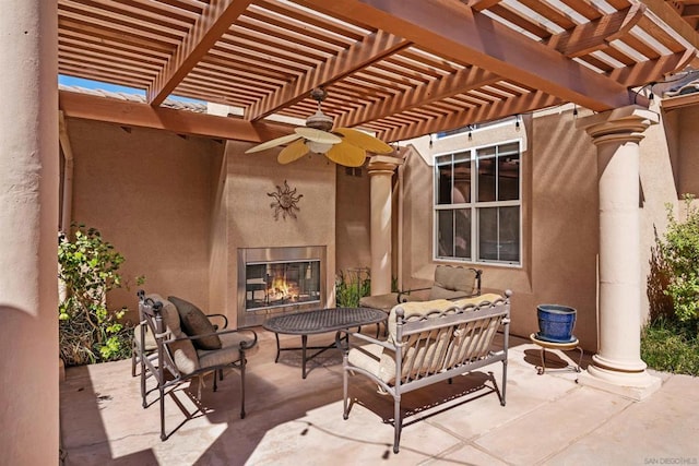 view of patio featuring a pergola and an outdoor living space with a fireplace