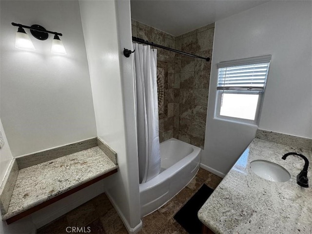 bathroom featuring vanity and shower / bath combination with curtain