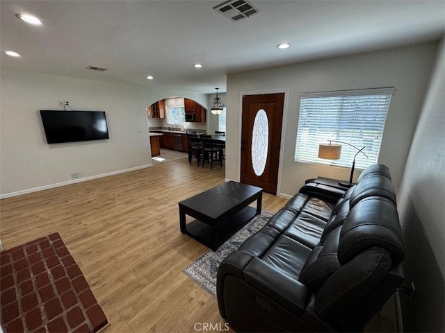 living room with light hardwood / wood-style floors