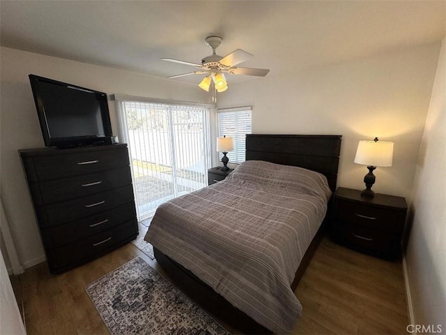 bedroom featuring hardwood / wood-style flooring, ceiling fan, and access to exterior