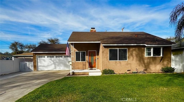 view of front of home featuring a garage and a front lawn