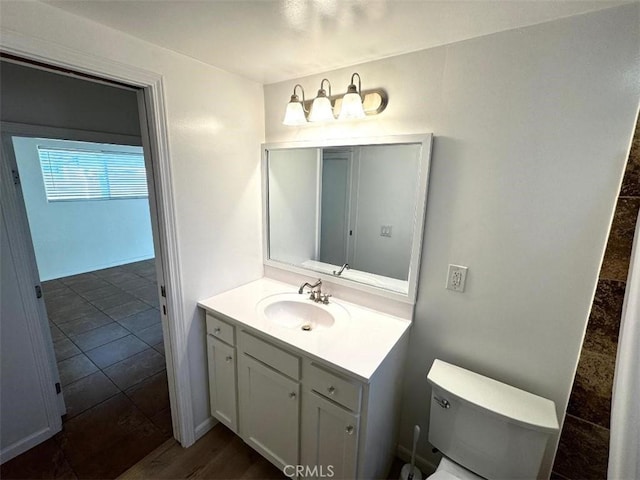 bathroom with vanity and toilet