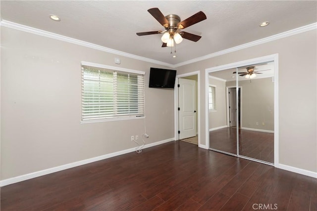 unfurnished bedroom with ornamental molding, recessed lighting, wood finished floors, and baseboards