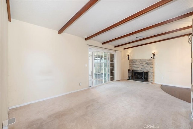 unfurnished living room with a stone fireplace, carpet flooring, visible vents, baseboards, and beam ceiling