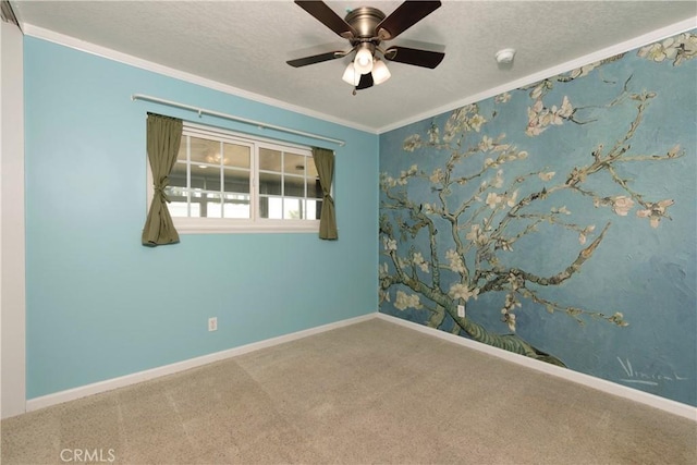 unfurnished room featuring baseboards, carpet, and crown molding