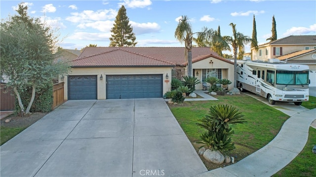 view of front of house featuring a garage and a front yard