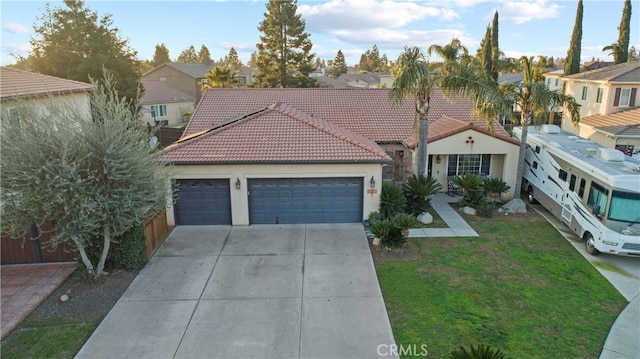 view of front of property with a garage and a front yard