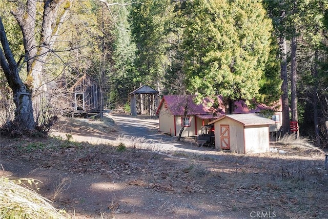 view of front of house with a shed