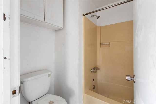 bathroom featuring shower / bathing tub combination and toilet