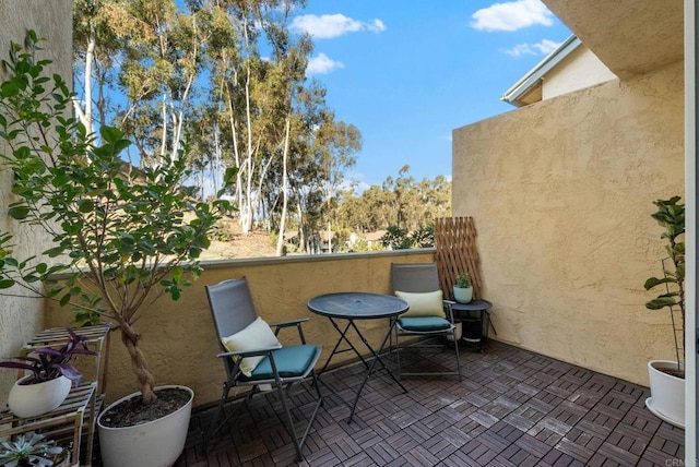 view of patio / terrace with a balcony