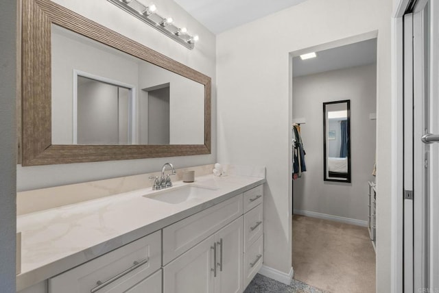 bathroom featuring vanity and baseboards