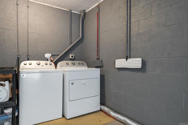 clothes washing area with laundry area and separate washer and dryer