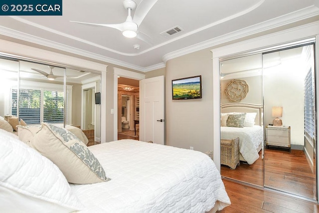 bedroom featuring crown molding, hardwood / wood-style floors, ceiling fan, and a closet