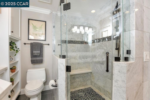 bathroom with crown molding, toilet, and an enclosed shower