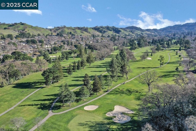 birds eye view of property with a mountain view