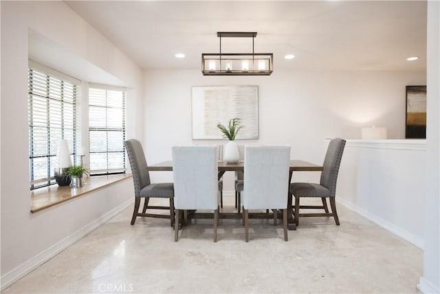 dining space with an inviting chandelier