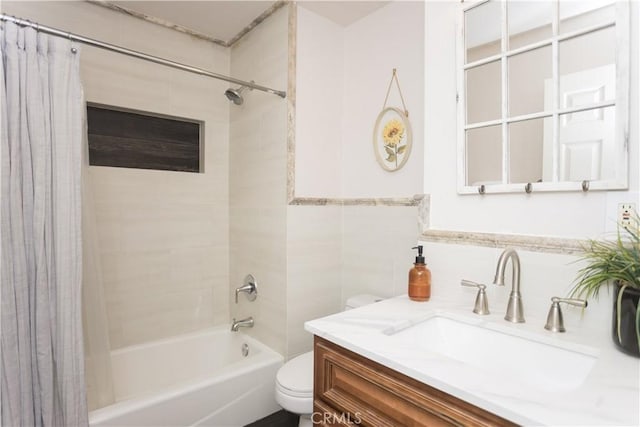 full bathroom featuring vanity, toilet, and shower / bath combo