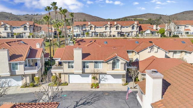 birds eye view of property featuring a mountain view