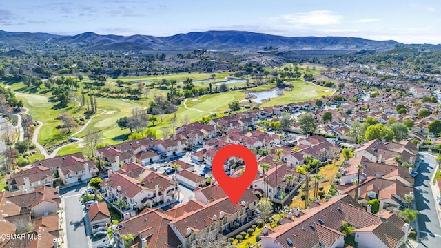 birds eye view of property with a mountain view