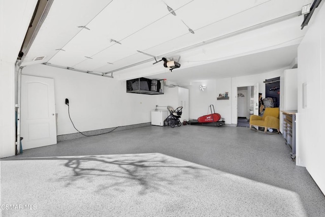 garage featuring a garage door opener