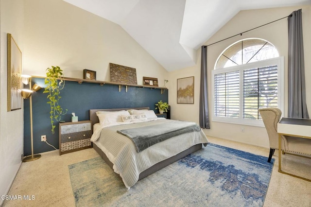 carpeted bedroom featuring vaulted ceiling