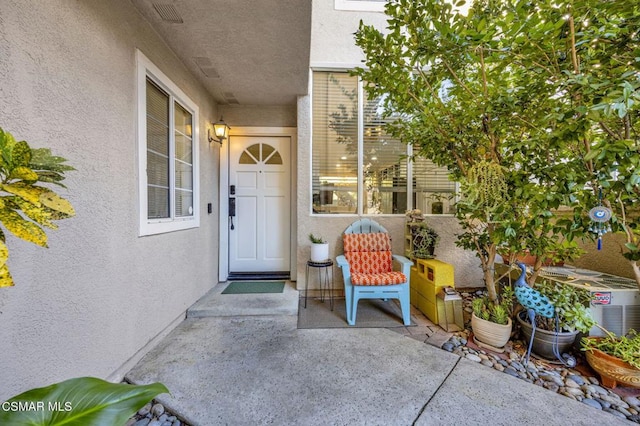 doorway to property featuring a patio