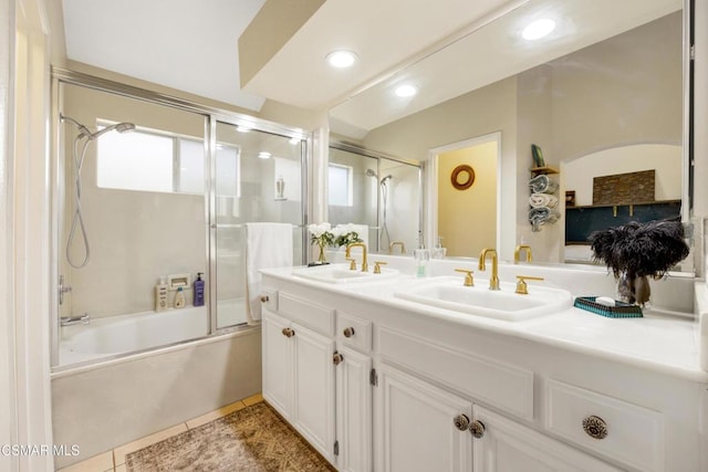 bathroom with enclosed tub / shower combo, a healthy amount of sunlight, tile patterned floors, and vanity