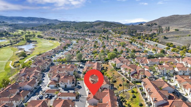 birds eye view of property featuring a water and mountain view