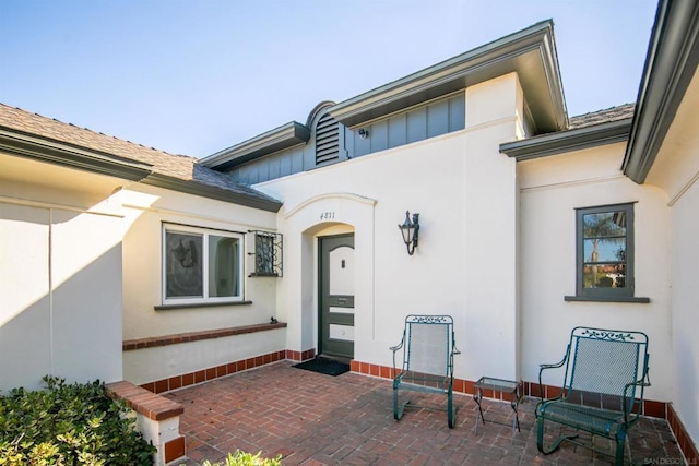 property entrance featuring a patio