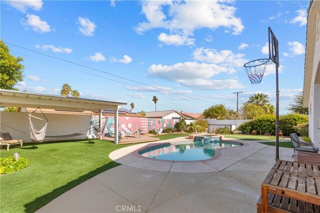 view of pool with an in ground hot tub, a patio, and a lawn