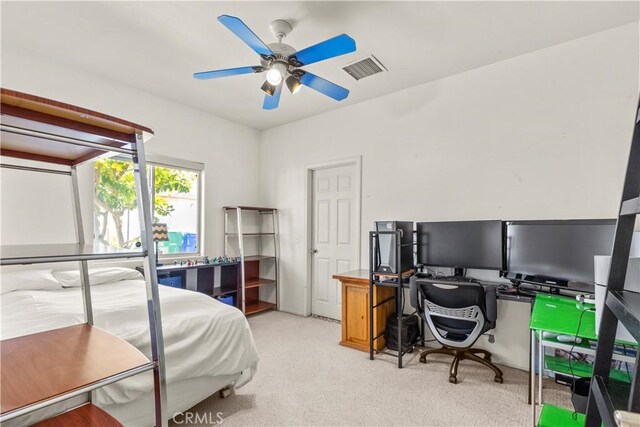 bedroom with light carpet, ceiling fan, and visible vents