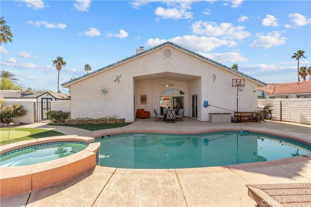 view of swimming pool with a patio area and an in ground hot tub