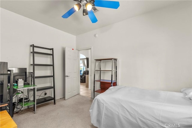 carpeted bedroom featuring visible vents and ceiling fan